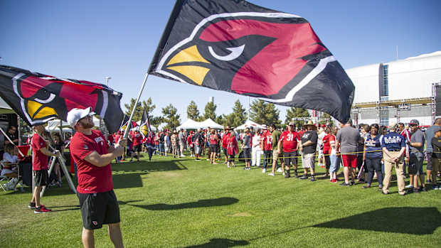 Arizona Cardinals fans arrive at the NFL Draft party on the Great Lawn outside State Farm Stadium, Thursday, April 25, 2019.