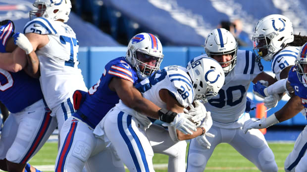 Buffalo Bills defensive end Jerry Hughes wraps up Indianapolis Colts running back Jonathan Taylor in the Bills' 27-24 AFC Wild Card Playoffs victory at Bills Stadium.