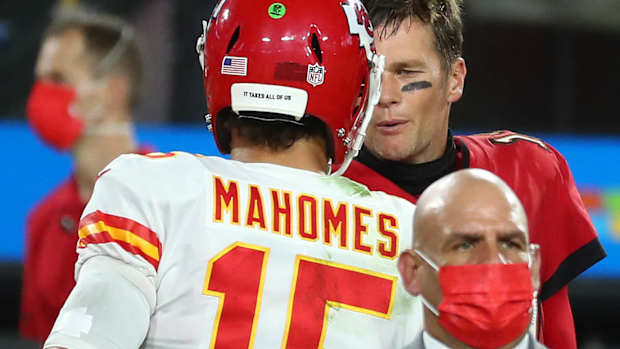 Nov 29, 2020; Tampa, Florida, USA; Kansas City Chiefs quarterback Patrick Mahomes (15) meets with Tampa Bay Buccaneers quarterback Tom Brady (12) following the victory at Raymond James Stadium. Mandatory Credit: Kim Klement-USA TODAY Sports