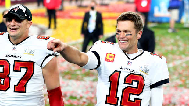 Feb 7, 2021; Tampa, FL, USA; Tampa Bay Buccaneers quarterback Tom Brady (12) and tight end Rob Gronkowski (87) celebrate after beating the Kansas City Chiefs in Super Bowl LV at Raymond James Stadium. Mandatory Credit: Mark J. Rebilas-USA TODAY Sports
