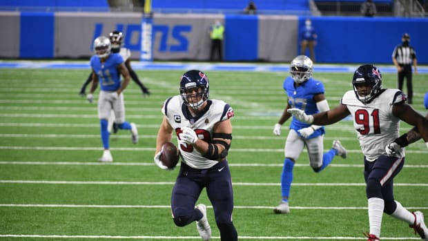 Nov 26, 2020; Detroit, Michigan, USA; Houston Texans defensive end J.J. Watt (99) runs for a touchdown after intercepting the ball during the first quarter against the Detroit Lions at Ford Field. Mandatory Credit: Tim Fuller-USA TODAY Sports