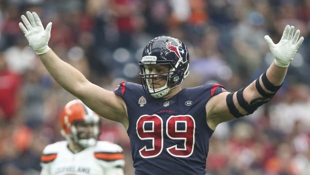 Dec 2, 2018; Houston, TX, USA; Houston Texans defensive end J.J. Watt (99) reacts and Cleveland Browns quarterback Baker Mayfield (6) looks on after a play during the second quarter at NRG Stadium. Mandatory Credit: Troy Taormina-USA TODAY Sports