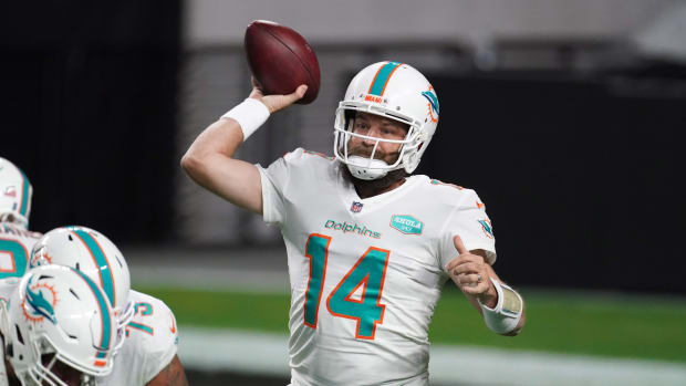 Dec 26, 2020; Paradise, Nevada, USA; Miami Dolphins quarterback Ryan Fitzpatrick (14) throws a pass in the fourth quarter against the Las Vegas Raidersat Allegiant Stadium. The Dolphins defeated the Raiders 26-25. Mandatory Credit: Kirby Lee-USA TODAY Sports