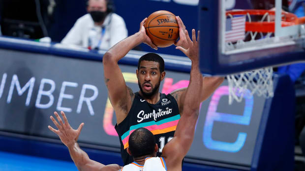 Spurs center LaMarcus Aldridge is defended by Thunder center Al Horford