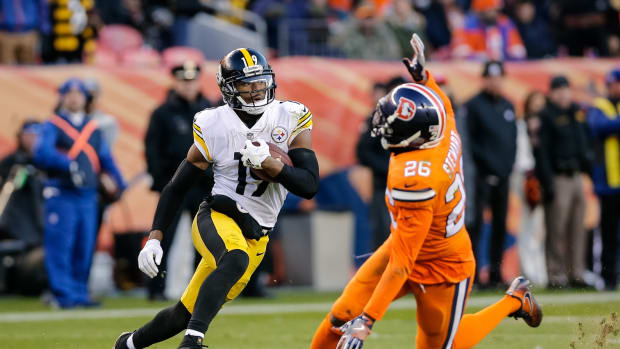 Nov 25, 2018; Denver, CO, USA; Pittsburgh Steelers wide receiver JuJu Smith-Schuster (19) runs past Denver Broncos strong safety Darian Stewart (26) on a 97 yard touchdown in the third quarter at Broncos Stadium at Mile High. Mandatory Credit: Isaiah J. Downing-USA TODAY Sports