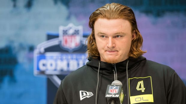 Offensive line prospect Ben Bartch stands at the podium at the NFL draft combine