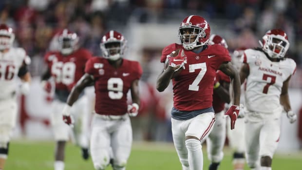 Oct 26, 2019; Tuscaloosa, AL, USA; Alabama Crimson Tide defensive back Trevon Diggs (7) returns an interception for a touchdown during the first half of an NCAA college football game at Bryant-Denny Stadium.