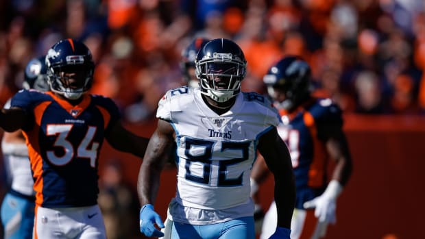 Tennessee Titans tight end Delanie Walker (82) reacts in the first quarter against the Denver Broncos at Empower Field at Mile High.