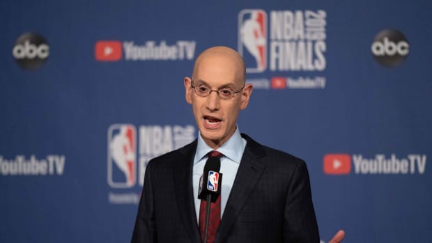 NBA commissioner Adam Silver speaks with reporters prior to a Finals game between the Warriors and Raptors.