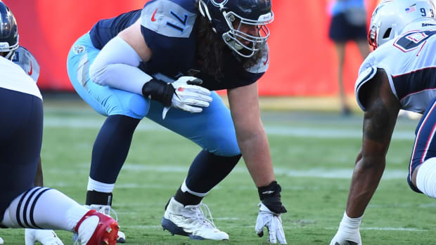 Tennessee Titans offensive tackle Dennis Kelly (71) lines up against the New England Patriots defense during the first half of the preseason game at Nissan Stadium.
