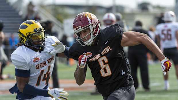 Jan 22, 2020; Mobile, Alabama, USA; North safety Josh Metellus of Michigan (14) and North wide receiver Michael Pittman Jr. of USC (6) spar in passing drills during Senior Bowl practice at Ladd-Peebles Stadium.