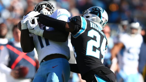 Nov 3, 2019; Charlotte, NC, USA; Tennessee Titans wide receiver A.J. Brown (11) catches a pass against Carolina Panthers cornerback James Bradberry (24) during the fourth quarter at Bank of America Stadium.