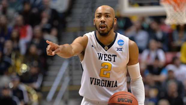 West Virginia Mountaineers guard Jevon Carter (2) controls the ball against the Marshall Thundering Herd during the first half in the second round of the 2018 NCAA Tournament at Viejas Arena.