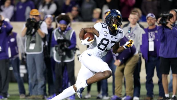 West Virginia Mountaineers wide receiver Bryce Wheaton (83) scores the game-winning touchdown in the fourth quarter of a game against the Kansas State Wildcats at Bill Snyder Family Stadium.