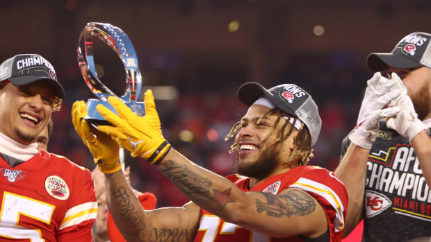 Jan 19, 2020; Kansas City, Missouri, USA; Kansas City Chiefs safety Tyrann Mathieu (32) celebrates with the Lamar Hunt Trophy after defeating the Tennessee Titans in the AFC Championship Game at Arrowhead Stadium. Mandatory Credit: Mark J. Rebilas-USA TODAY Sports