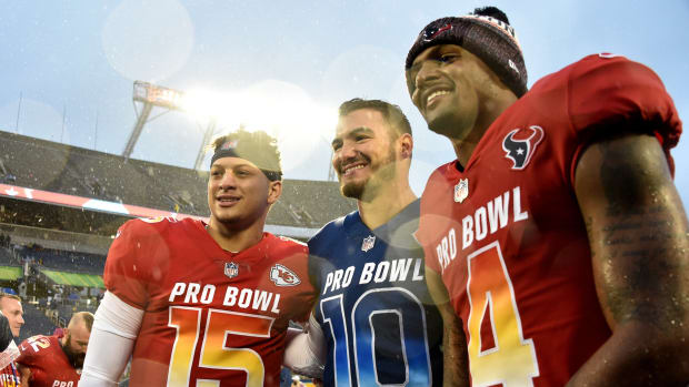 Jan 27, 2019; Orlando, FL, USA; AFC quarterback Patrick Mahomes of the Kansas City Chiefs (left) NFC quarterback Mitchell Trubisky of the Chicago Bears (center) and AFC quarterback Deshaun Watson of the Houston Texans (right) all pose for a picture after their game in the NFL Pro Bowl football game at Camping World Stadium. Mandatory Credit: Steve Mitchell-USA TODAY Sports