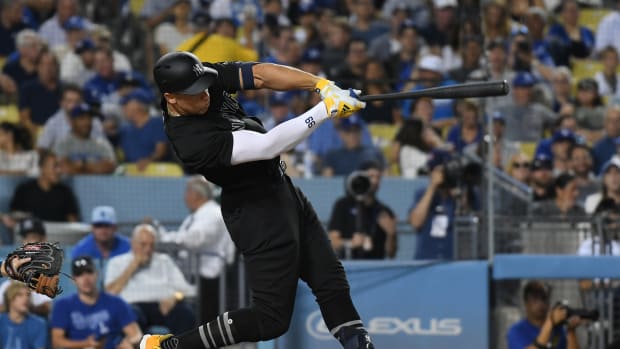 Aug 23, 2019; Los Angeles, CA, USA; New York Yankees right fielder Aaron Judge (99) hits a solo home run in the third inning against the Los Angeles Dodgers during an MLB Players' Weekend game at Dodger Stadium. Mandatory Credit: Richard Mackson-USA TODAY Sports