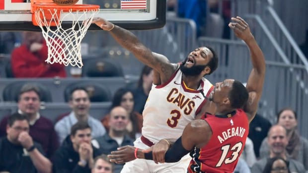 Cleveland Cavaliers center Andre Drummond misses a dunk beside Miami Heat forward Bam Adebayo in the first quarter at Rocket Mortgage FieldHouse.