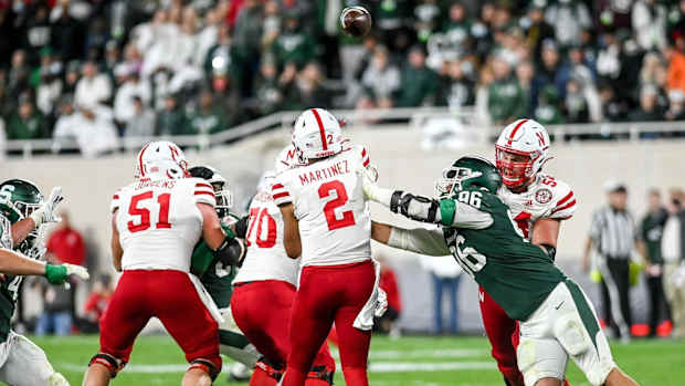 Adrian Martinez pass under pressure Jacub Panasuik 2021 Michigan State offensive line USATSI_16830445