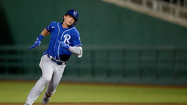 Kansas City Royals Bobby Witt Jr., rounds the bases on an error, inside the park home run, which was misplayed by Cincinnati Reds left fielder Errol Robinson in the eighth inning of the MLB Cactus League Spring Training game between the Cincinnati Reds and the Kansas City Royals at Goodyear Ballpark in Goodyear, Ariz., on Thursday, March 4, 2021. The Royals won 5-3 in a nine-inning game. Kansas City Royals At Cincinnati Reds Spring Training