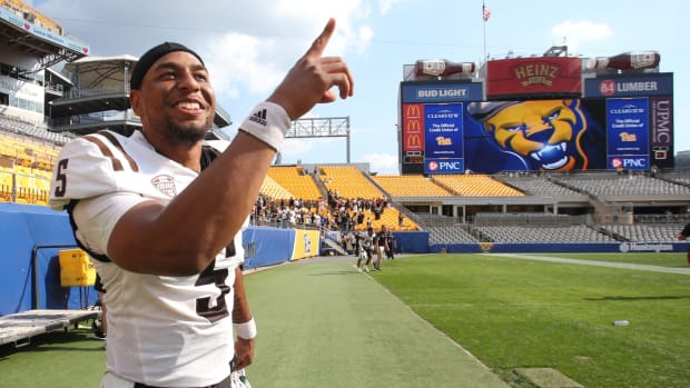 Sep 18, 2021; Pittsburgh, Pennsylvania, USA; Western Michigan Broncos quarterback Kaleb Eleby (5) reacts leaving the field after defeating the Pittsburgh Panthers at Heinz Field. The Broncos won 44-41. Mandatory Credit: Charles LeClaire-USA TODAY Sports