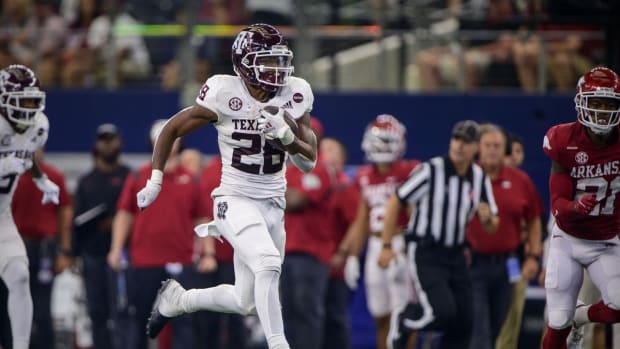 Sep 25, 2021; Arlington, Texas, USA; Texas A&amp;M Aggies running back Isaiah Spiller (28) runs for a touchdown against the Arkansas Razorbacks during the second half at AT&amp;T Stadium. Mandatory Credit: Jerome Miron-USA TODAY Sports