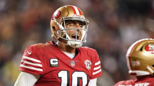 Sep 26, 2021; Santa Clara, California, USA; San Francisco 49ers quarterback Jimmy Garoppolo (10) celebrates after a touchdown by fullback Kyle Juszczyk (44) during the fourth quarter against the Green Bay Packers at Levi's Stadium. Mandatory Credit: Darren Yamashita-USA TODAY Sports