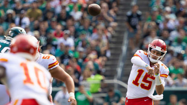 Oct 3, 2021; Philadelphia, Pennsylvania, USA; Kansas City Chiefs quarterback Patrick Mahomes (15) passes the ball to wide receiver Tyreek Hill (10) during the first quarter against the Philadelphia Eagles at Lincoln Financial Field. Mandatory Credit: Bill Streicher-USA TODAY Sports