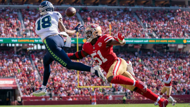 Seattle Seahawks wide receiver Freddie Swain (18) catches a touchdown pass against San Francisco 49ers linebacker Azeez Al-Shaair (51) during the third quarter at Levi's Stadium.