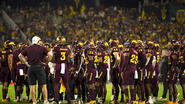 ASU team huddled