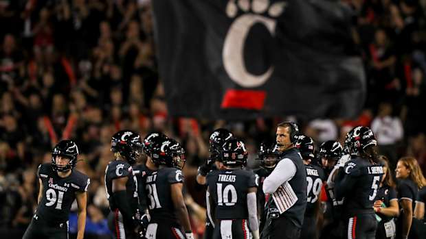 Luke Fickell and Cincinnati Logo Banner