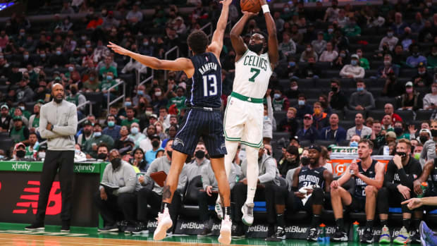 Oct 4, 2021; Boston, Massachusetts, USA; Boston Celtics guard Jaylen Brown (7) shoots defended by Orlando Magic guard RJ Hampton (13) during the second half at TD Garden. Mandatory Credit: Paul Rutherford-USA TODAY Sports