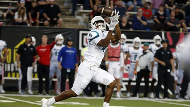 Oct 7, 2021; Jonesboro, Arkansas, USA; Coastal Carolina Chanticleers tight end Isaiah Likely (4) catches a pass for a touchdown during the first half against the Arkansas State Red Wolves at Centennial Bank Stadium.