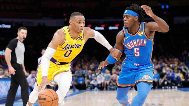 Russell Westbrook is guarded by Lu Dort