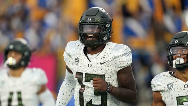 Oct 23, 2021; Pasadena, California, USA; Oregon Ducks quarterback Anthony Brown (13) celebrates after scoring on a 43-yard touchdown run against the UCLA Bruins in the second half at Rose Bowl. Oregon defeated UCLA 34-31. Mandatory Credit: Kirby Lee-USA TODAY Sports