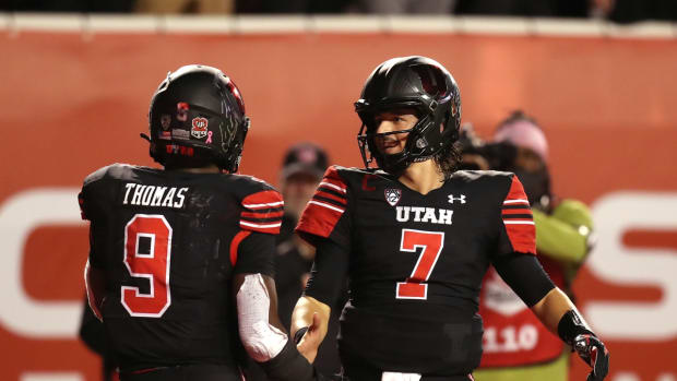 Oct 30, 2021; Salt Lake City, Utah, USA; Utah Utes running back Tavion Thomas (9) celebrates his touchdown with quarterback Cameron Rising (7) during the fourth quarter against the UCLA Bruins at Rice-Eccles Stadium. Mandatory Credit: Rob Gray-USA TODAY Sports
