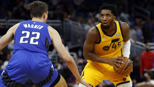 Nov 7, 2021; Orlando, Florida, USA; Utah Jazz guard Donovan Mitchell (45) drives to the basket as Orlando Magic forward Franz Wagner (22) defends during the second half at Amway Center. Mandatory Credit: Kim Klement-USA TODAY Sports