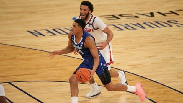 Mar 11, 2021; New York, NY, USA; Seton Hall Pirates guard Jared Rhoden (14) drives the ball against St. John Red Storm guard Julian Champagnie (2) during the first half of a Big East tournament game at Madison Square Garden. Mandatory Credit: Brad Penner-USA TODAY Sports