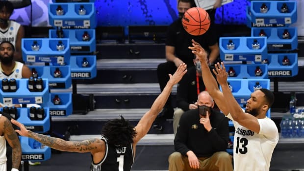Mar 20, 2021; Indianapolis, Indiana, USA; Colorado Buffaloes forward Dallas Walton (13) shoots over Georgetown Hoyas forward Jamorko Pickett (1) during the first round of the 2021 NCAA Tournament at Hinkle Fieldhouse. Mandatory Credit: Patrick Gorski-USA TODAY Sports