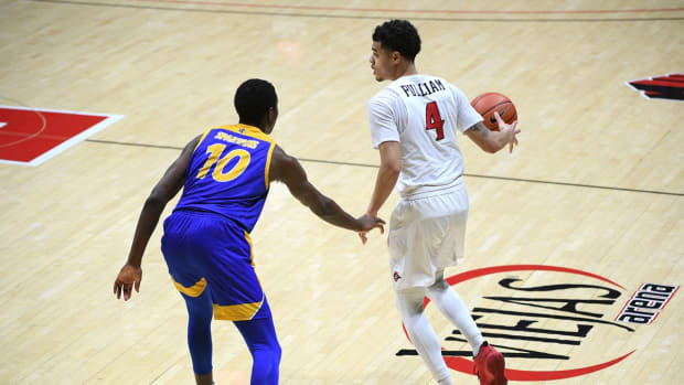 Feb 8, 2021; San Diego, California, USA; San Diego State Aztecs guard Trey Pulliam (4) dribbles the ball while defended by San Jose State Spartans guard Omari Moore (10) during the second half at Viejas Arena. Mandatory Credit: Orlando Ramirez-USA TODAY Sports