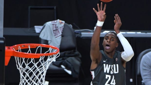 Mar 10, 2021; Las Vegas, NV, USA; Washington State Cougars guard Noah Williams (24) shoots during the first half against the Arizona State Sun Devils at T-Mobile Arena. Mandatory Credit: Stephen R. Sylvanie-USA TODAY Sports