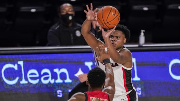 Dec 22, 2020; Athens, Georgia, USA; Georgia Bulldogs guard Sahvir Wheeler (right) shoots over Northeastern Huskies guard Tyson Walker (2) during the first half at Stegeman Coliseum. Mandatory Credit: Dale Zanine-USA TODAY Sports