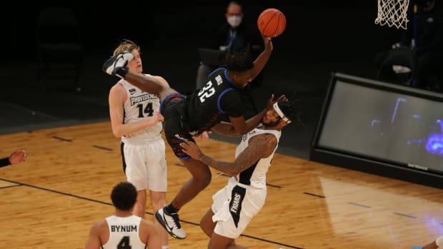Mar 10, 2021; New York, NY, USA; DePaul Blue Demons forward David Jones (32) shoots over Providence Friars center Nate Watson (0) during the second half of a Big East conference tournament game at Madison Square Garden. Mandatory Credit: Brad Penner-USA TODAY Sports