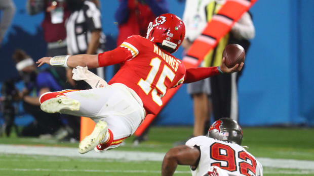Feb 7, 2021; Tampa, FL, USA; Kansas City Chiefs quarterback Patrick Mahomes (15) throws a sidearm pass in the air against Tampa Bay Buccaneers defensive end William Gholston (92) during the fourth quarter in Super Bowl LV at Raymond James Stadium. Mandatory Credit: Mark J. Rebilas-USA TODAY Sports