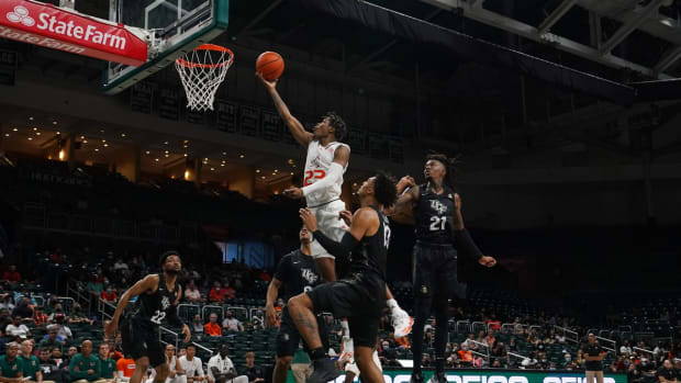 Nov 13, 2021; Coral Gables, Florida, USA; Miami Hurricanes guard Kameron McGusty (23) shoots the ball against the UCF Knights during the second half at Watsco Center. Mandatory Credit: Jasen Vinlove-USA TODAY Sports
