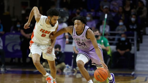 Nov 10, 2021; Manhattan, Kansas, USA; Kansas State Wildcats guard Nijel Pack (24) dribbles against Florida A&amp;M Rattlers guard Dimingus Stevens (0) during the second half at Bramlage Coliseum. Mandatory Credit: Scott Sewell-USA TODAY Sports