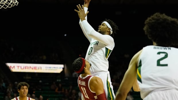 Nov 20, 2021; Waco, Texas, USA; Baylor Bears forward Flo Thamba (0) shoots against Stanford Cardinal forward Jaiden Delaire (11) during the first half at Ferrell Center. Mandatory Credit: Chris Jones-USA TODAY Sports