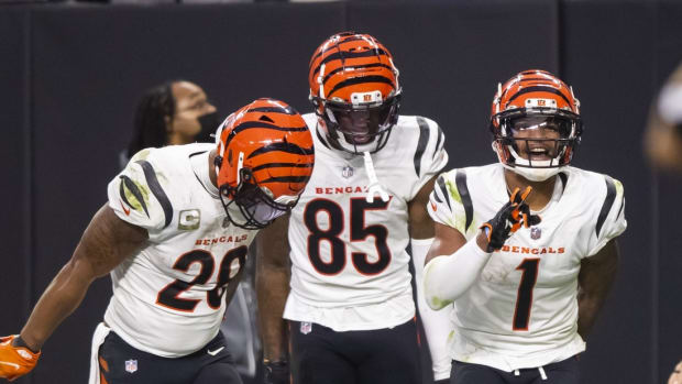 Nov 21, 2021; Paradise, Nevada, USA; Cincinnati Bengals wide receiver Ja'Marr Chase (1) celebrates with running back Joe Mixon (28) and wide receiver Tee Higgins (85) after scoring a touchdown against the Las Vegas Raiders in the second half at Allegiant Stadium. Mandatory Credit: Mark J. Rebilas-USA TODAY Sports