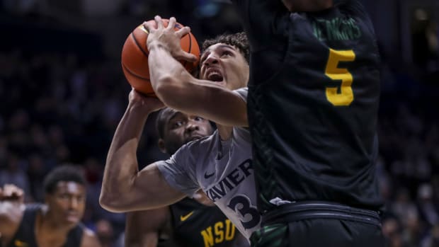Nov 21, 2021; Cincinnati, Ohio, USA; Xavier Musketeers guard Colby Jones (3) drives to the basket against Norfolk State Spartans guard Tyrese Jenkins (5) in the first half at Cintas Center. Mandatory Credit: Katie Stratman-USA TODAY Sports