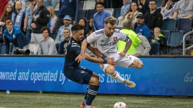 Nov 7, 2021; Kansas City, Kansas, USA; Sporting Kansas City midfielder Ilie Sanchez (6) and Real Salt Lake midfielder Albert Rusnak (11) collide along the sidelines during the second half at Children's Mercy Park. Mandatory Credit: William Purnell-USA TODAY Sports